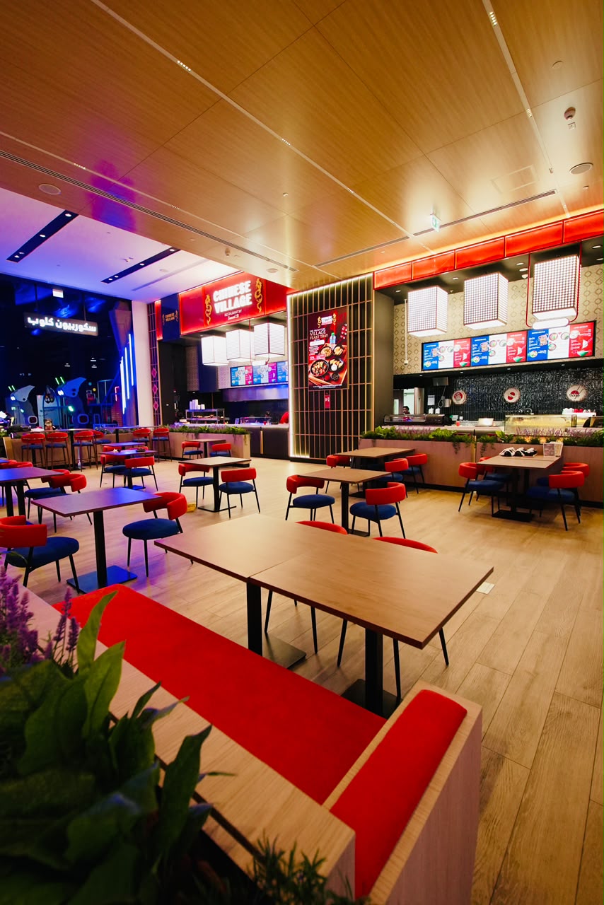 The vibrant dining room and open counter at Chinese Village restaurant